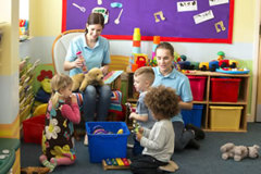 Teachers and Children Playing with Toys